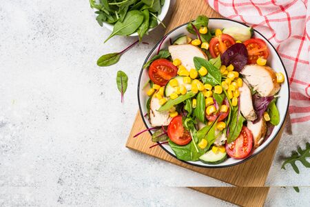Salad with Chicken and vevetables. Healthy food, diet lunch concept. Top view on white background.の写真素材
