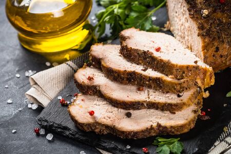 Baked pork meat ham on black.の写真素材