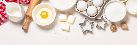 Baking ingredients at blue table top view.