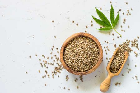 Cannabis seeds at white table top view.の写真素材
