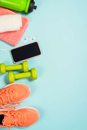 Fitness equipment at blue background top view.の写真素材