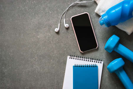 Fitness equipment at stone background top view.の写真素材