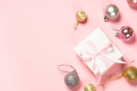 Christmas pink flat lay background with present box and decorations.の写真素材