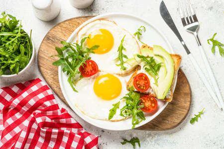 Healthy breakfast with egg, toast and salad.の写真素材