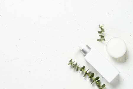 Eucalyptus cosmetic, spa product at white table.の写真素材
