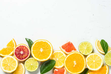 Citrus fruits at white background.