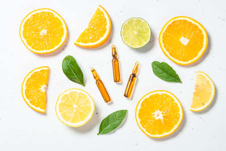 Vitamin C. Cosmetic products and fresh citrus fruits.の写真素材