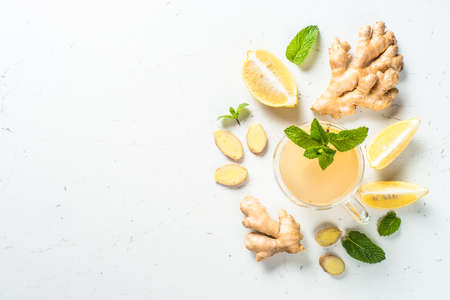 Ginger tea with lemon at white table.の写真素材