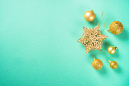 Christmas decorations at mint background top view.の写真素材