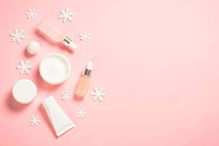 Winter cosmetic, skin care product on pink background.の写真素材