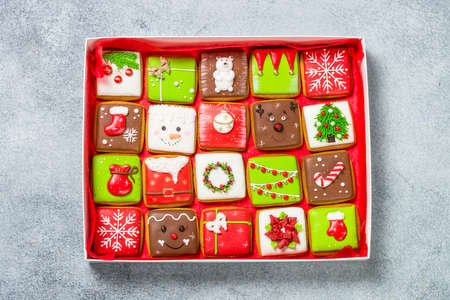 Christmas gingerbread cookies in present box with holidays decorations.の写真素材