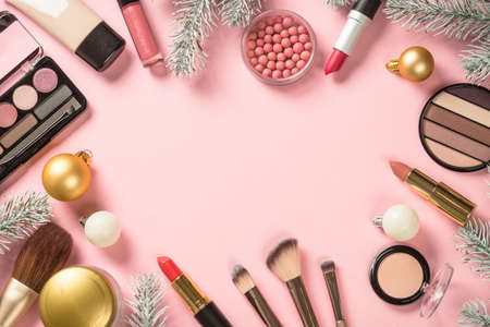 Make up products and christmas decorations at pink.の写真素材