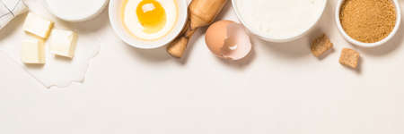 Baking ingredients at blue table top view.の写真素材