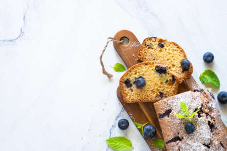 Blueberry cake on white background. Homemade sweet baking. Top view with place for your recipe.の写真素材