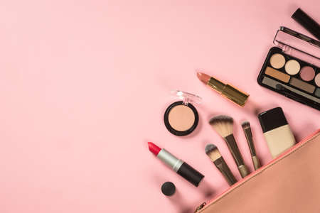 Make up products at pink background top view.の写真素材