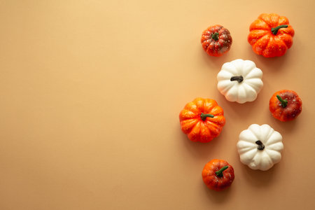 Fall autumn flat lay background. Pumpkins and fall leaves.の写真素材