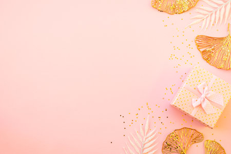 Pink christmas composition with gift box and decorations flat lay.の写真素材