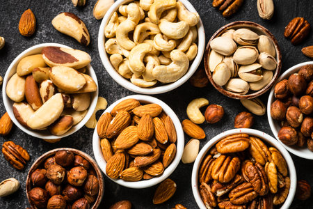 Assortment of nuts in bowls. Cashew, hazelnuts, pecan, almonds, brazilian nuts and pistachios.