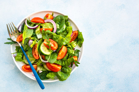 Fresh green salad with leaves and vegetables.の写真素材