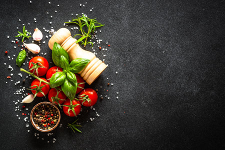 Food cooking background on black stone table.の写真素材