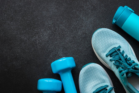 Fitness equipment at black background top view.の写真素材
