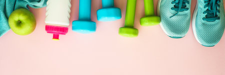 Fitness equipment on pink background, flat lay image.
