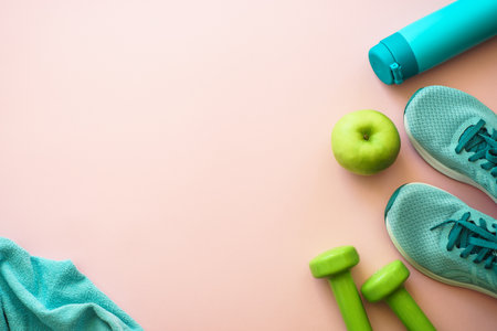 Fitness equipment on pink background, flat lay image.の写真素材