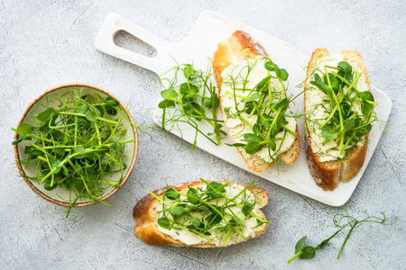 Toast with cream cheese and micro greens.