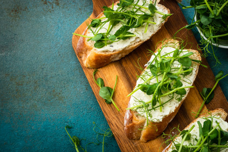 Toast with cream cheese and micro greens.の写真素材