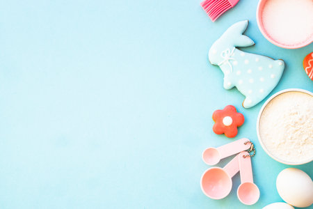 Easter baking background at blue flat lay.