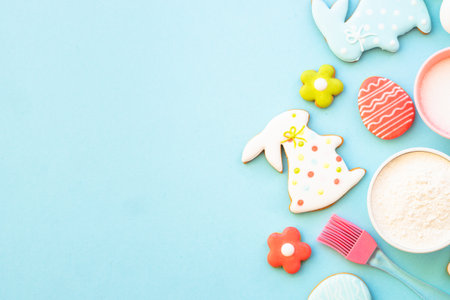 Easter baking background at blue flat lay.