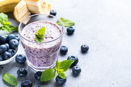 Blueberry smoothie or milkshake with fresh berries.の写真素材