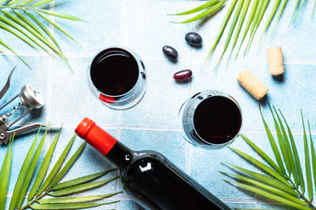Red wine with grape on blue background.の写真素材