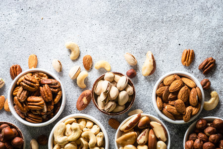 Assortment of nuts in bowls. Cashew, hazelnuts, pecan, almonds, brazilian nuts and pistachios.