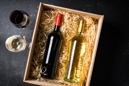 Red and white wine at black background.の写真素材