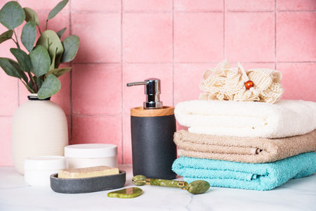 Clean towels and cosmetic products in the bathroom.