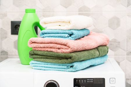 Clean towels and detergent in the laundry or bathroom.の写真素材