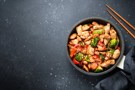 Chicken stir fry with vegetables and sesame.の写真素材