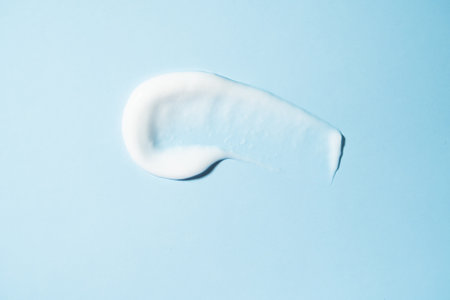 Cosmetic smears on a blue background.の写真素材