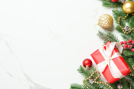 Christmas present with decor on white with space for design.の写真素材