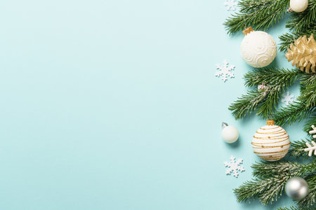 Christmas white and golden decorations on blue background with space for design.の写真素材