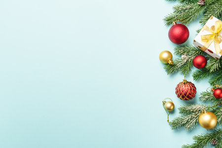 Christmas present with decor on blue with space for design.の写真素材