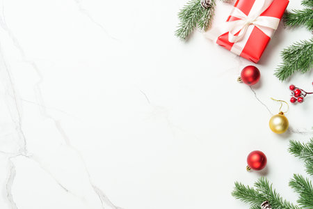 Christmas present with decor on white with space for design.の写真素材