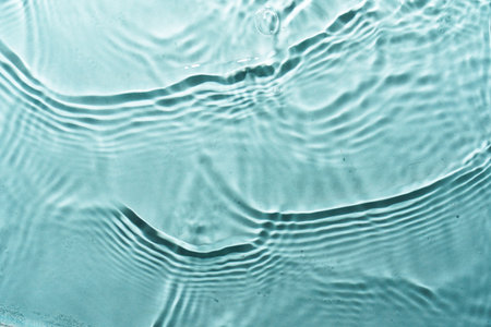 Water waves on blue background. Flat lay image with copy space.の写真素材