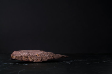 Background with stone podium at black.の写真素材