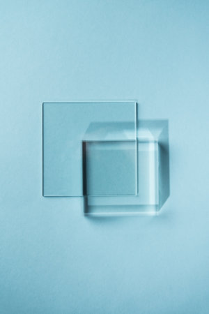 Glass on blue background for product presentation.の写真素材
