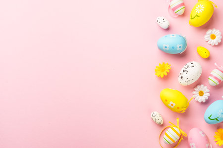 Easter eggs on colored background. Flat lay with copy space.の写真素材