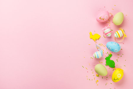Easter eggs and decorations on pink background. Flat lay image with copy space.の写真素材