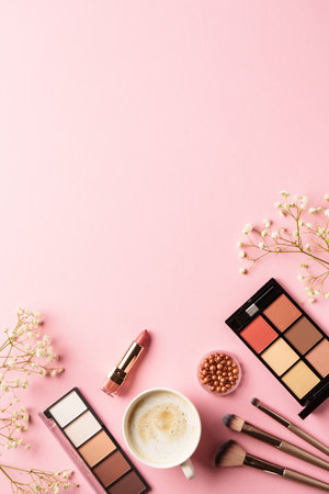 Spring flat lay background. Make up products, coffee and flowers.の写真素材