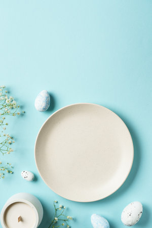 Easter table with eggs and flowers. Top view.の写真素材